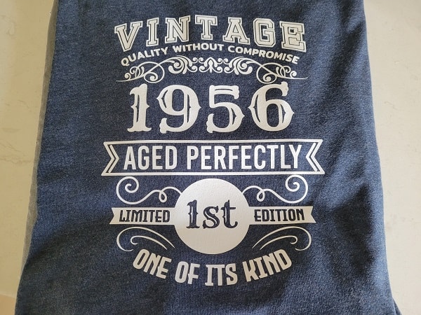 Vintage T-Shirt HTV finished project on a denim blue T-Shirt with White Siser HTV