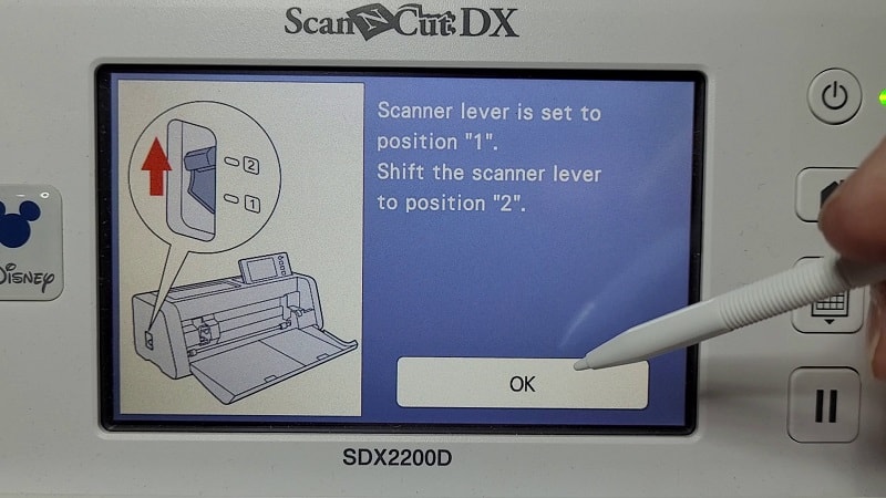Showing the scanner lever on the side of the SDX Scan N Cut cutting machine to adjust the height of the scanner.