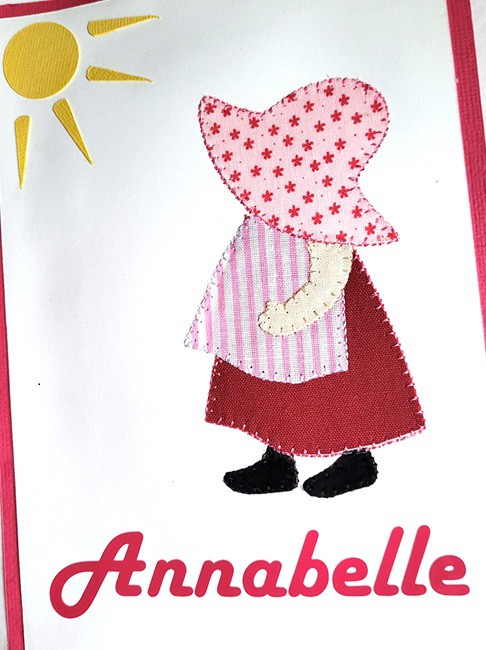 Appliqued Annabelle on a card using scrap fabric.